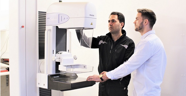Mammography systems with technician and sales person|Fuji Amulet mammography system|Mammography machine price - How much does a mammogram machine cost?|Mammography E-book - LBN Medical||Mammography Accessories - Extras