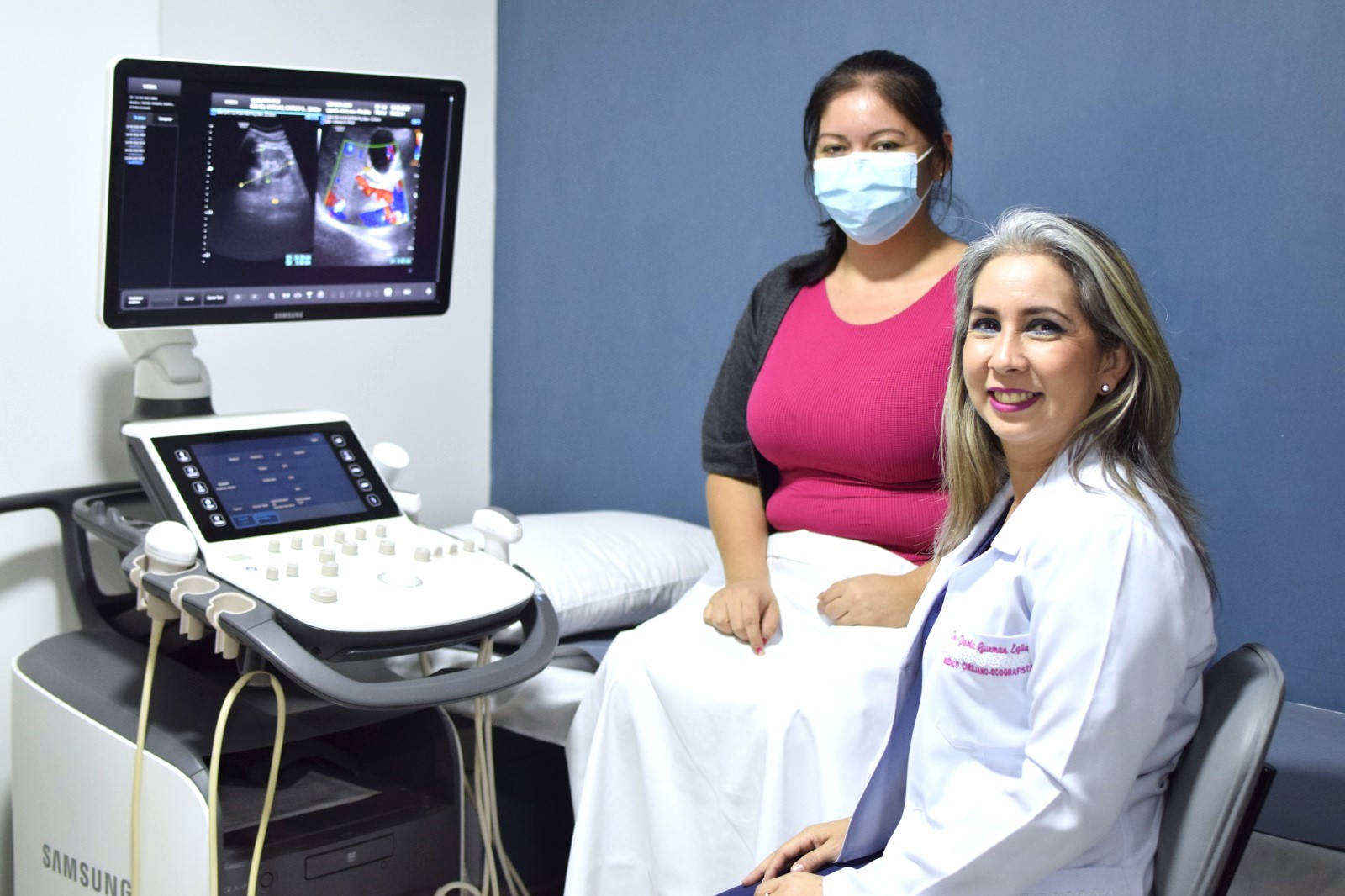 Happy customer scanning happy patient with Samsung WS80A ultrasound